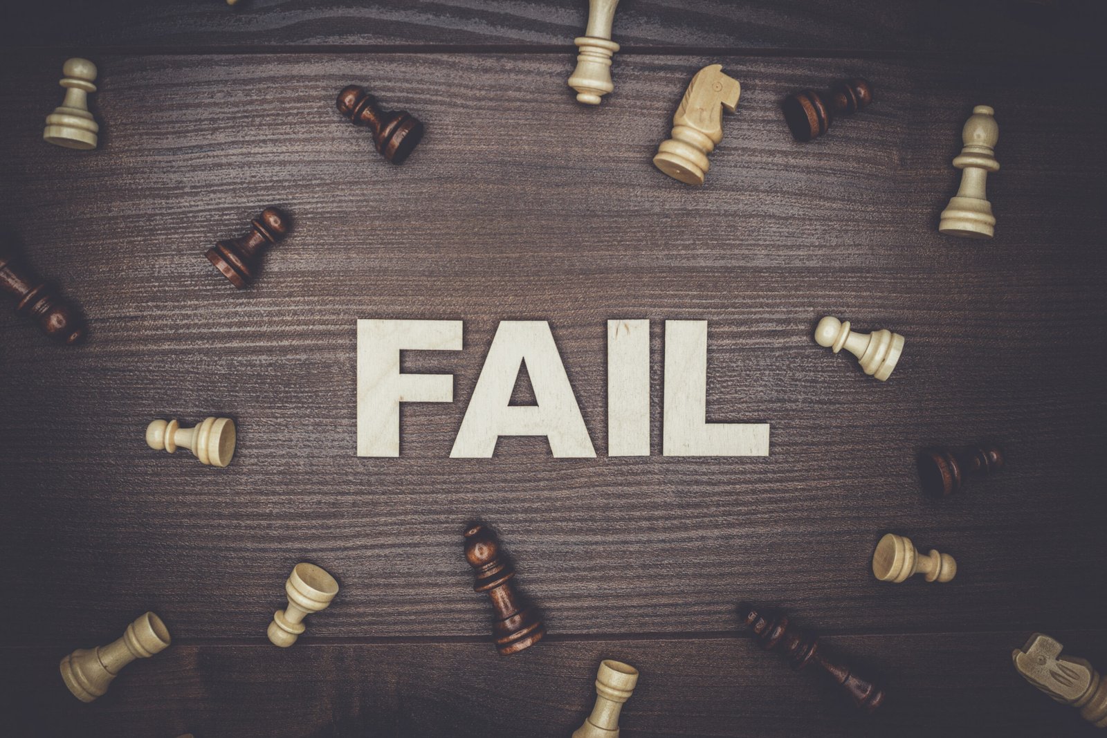 fail concept on wooden background